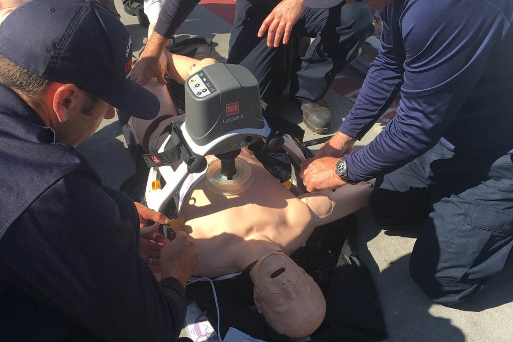 CPR dummy being used for cardia arrest.