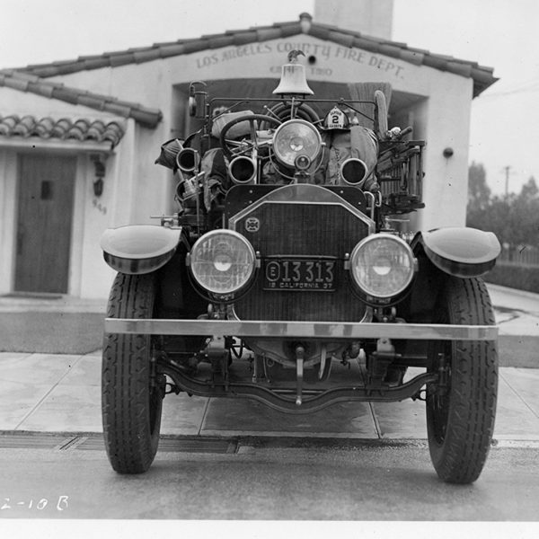 Front image of a history Photo of an older fire engine.