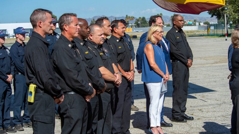 Group photo next to a super scooper.