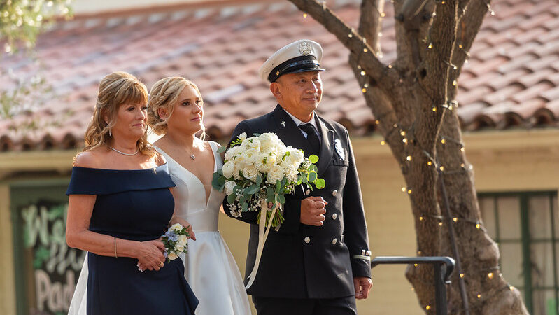 On Sunday, October 27, 2024, Ashley Weiss, daughter of fallen County of Los Angeles Fire Department (LACoFD) Fire Fighter Dale R. Weiss (1995) and Family Support Group Coordinator Ingrid Weiss, received a first-class escort from Engine 62 firefighters to her wedding ceremony.